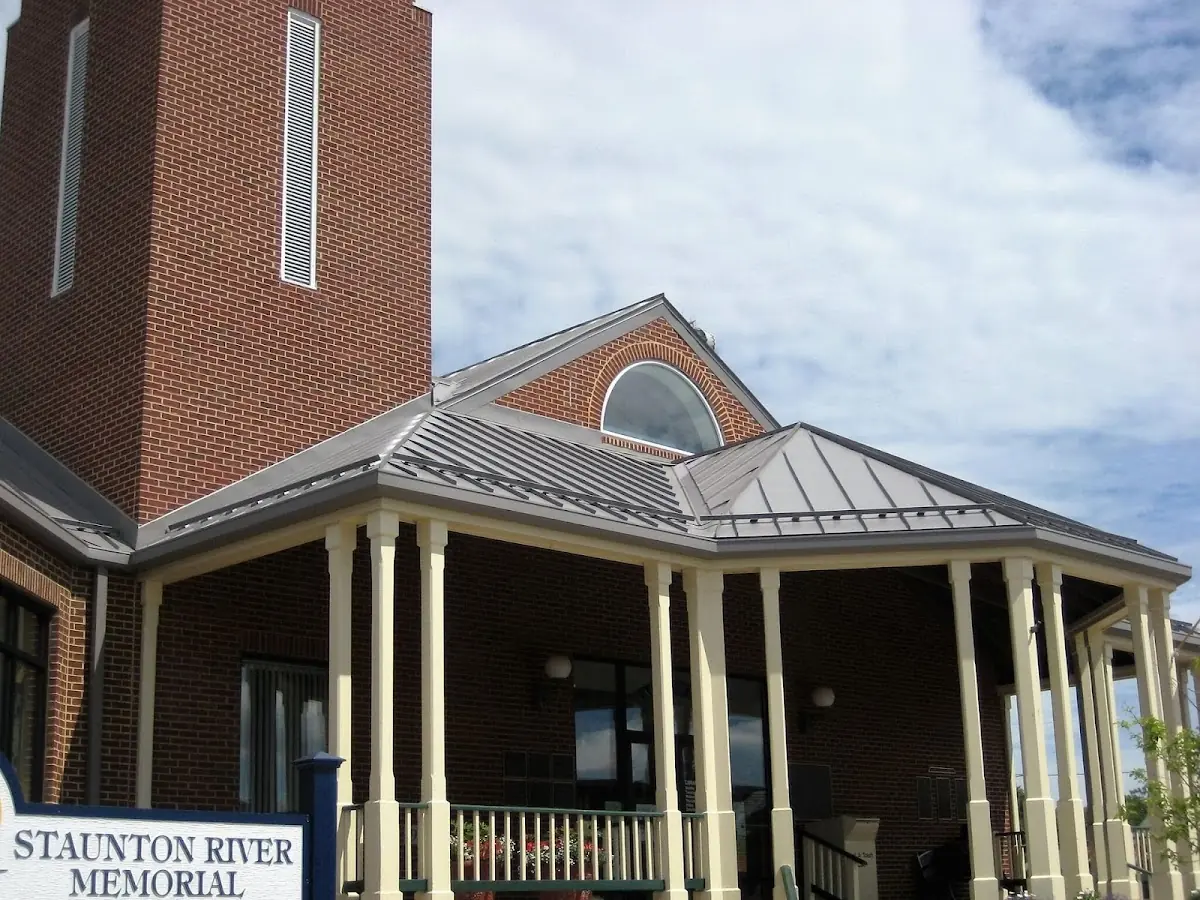 Skilled roofing craftsmen working on a residential roof in University Park